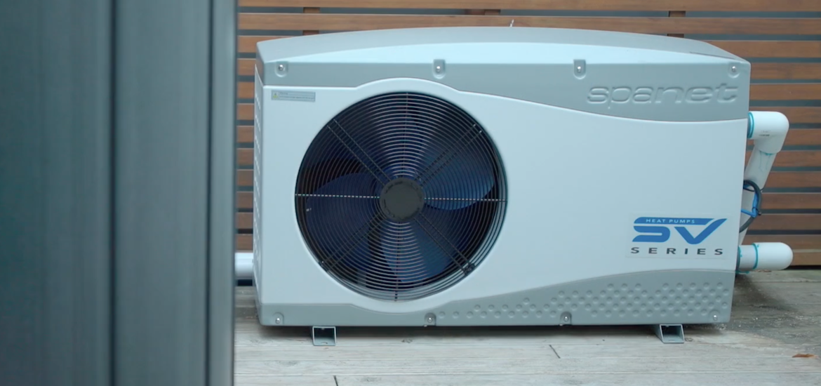 SpaNet SV heat pump beside a spa
