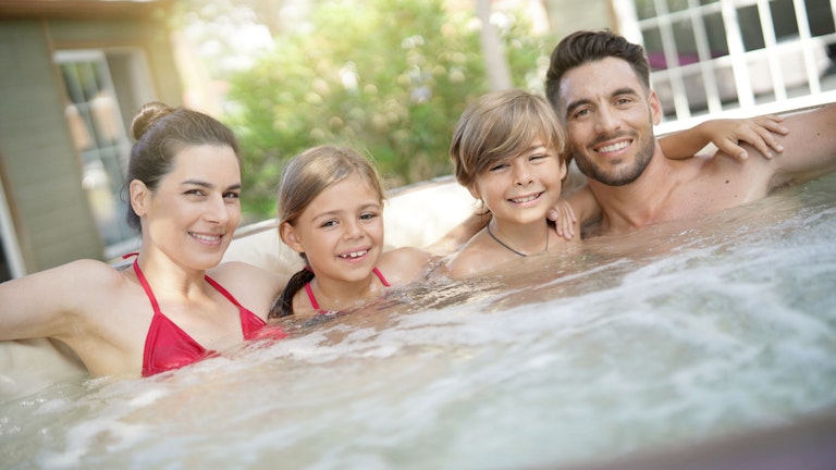 Family bonding in a spa pool