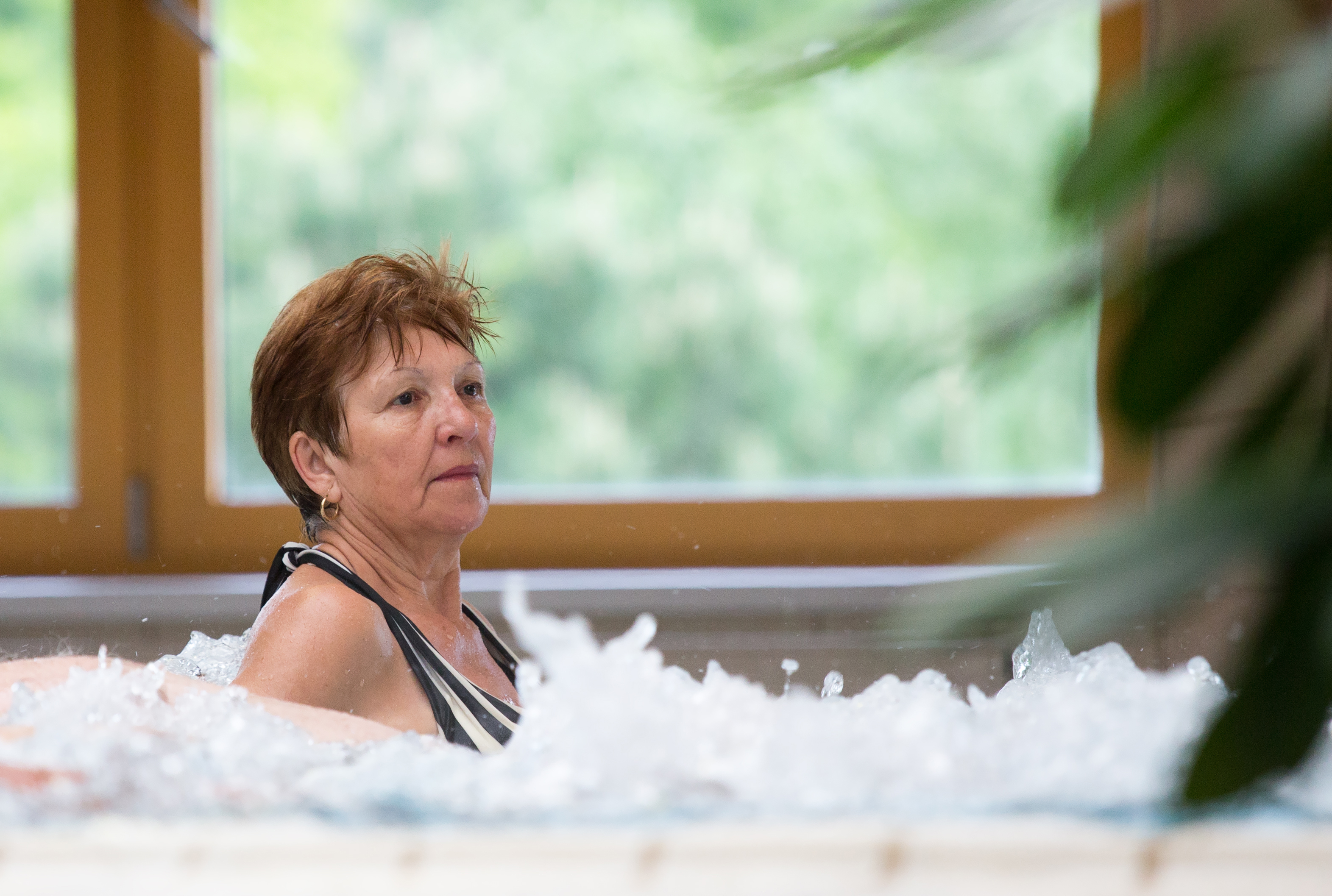 Elderly woman in a spa pool
