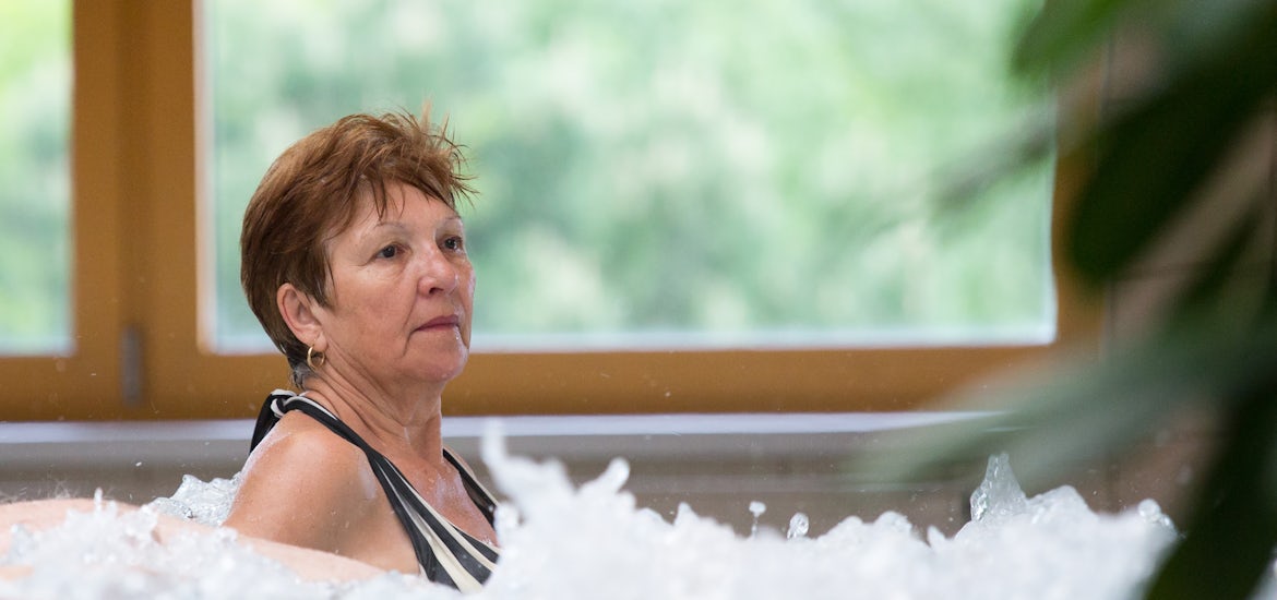 Elderly woman in a spa pool