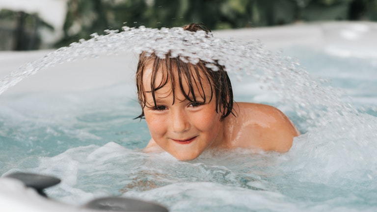 Child using hot tub