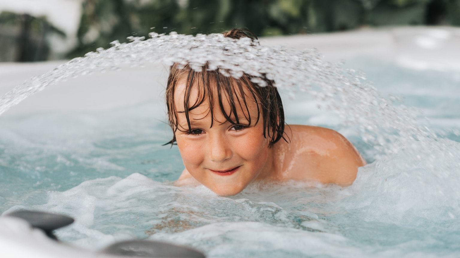 Child using hot tub