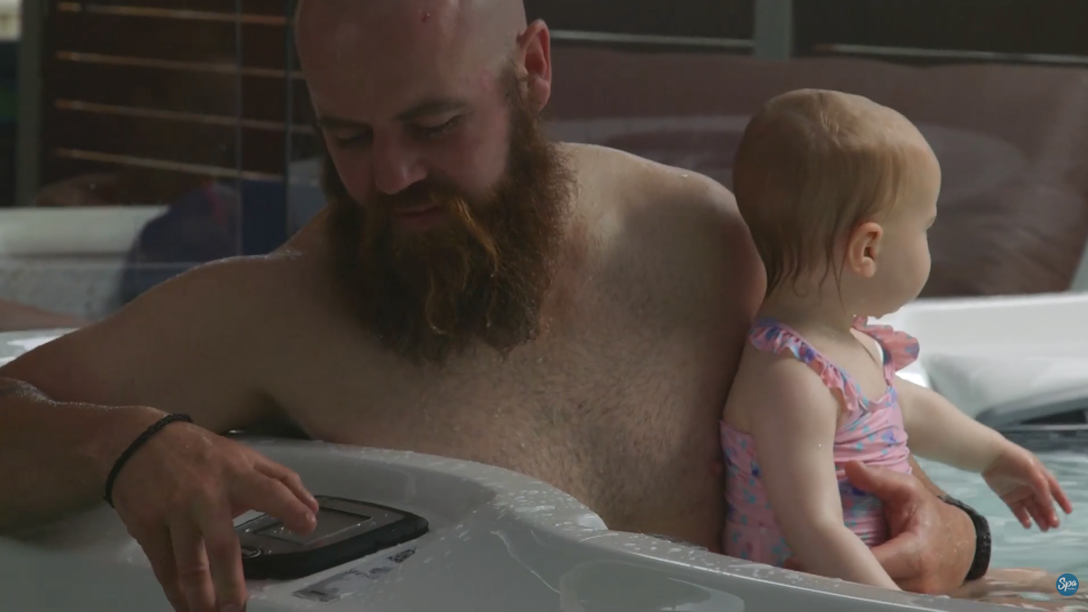 man with a baby operating j-495 keypad