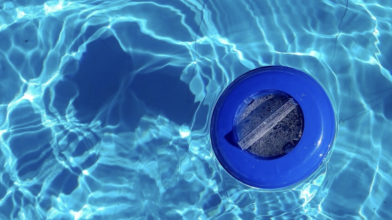 bromine tablet in a floating dispenser