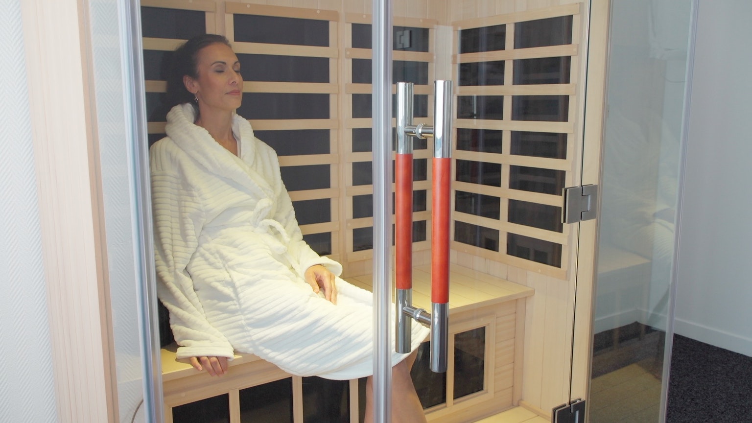 woman relaxing in an infrared sauna