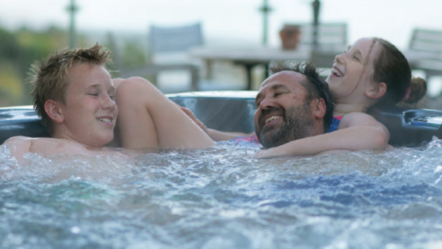 Family enjoying a Nitro spa pool