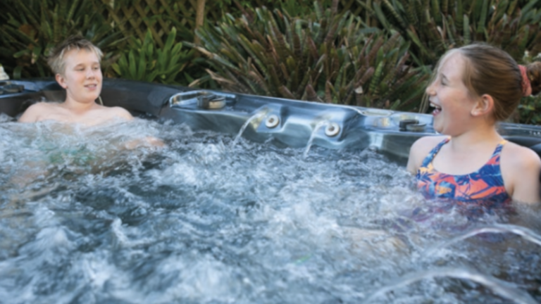 Siblings enjoying Nitro spa pool