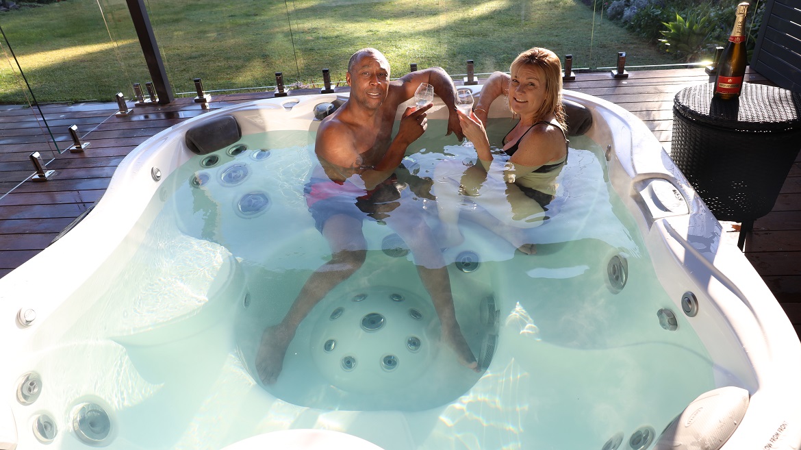 Couple in Jacuzzi® J-345™ hot tub
