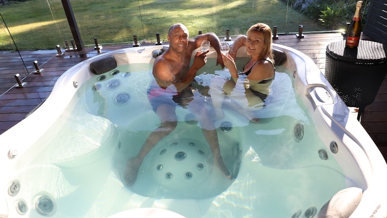 Couple in Jacuzzi® J-345™ hot tub