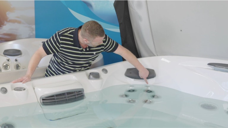 Checking water level in a Jacuzzi Spa