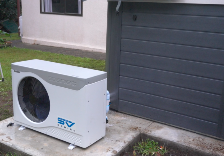 heat pump beside a spa pool