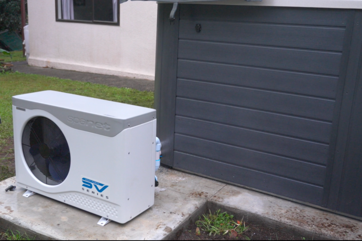 spanet heat pump installed on top of a concrete