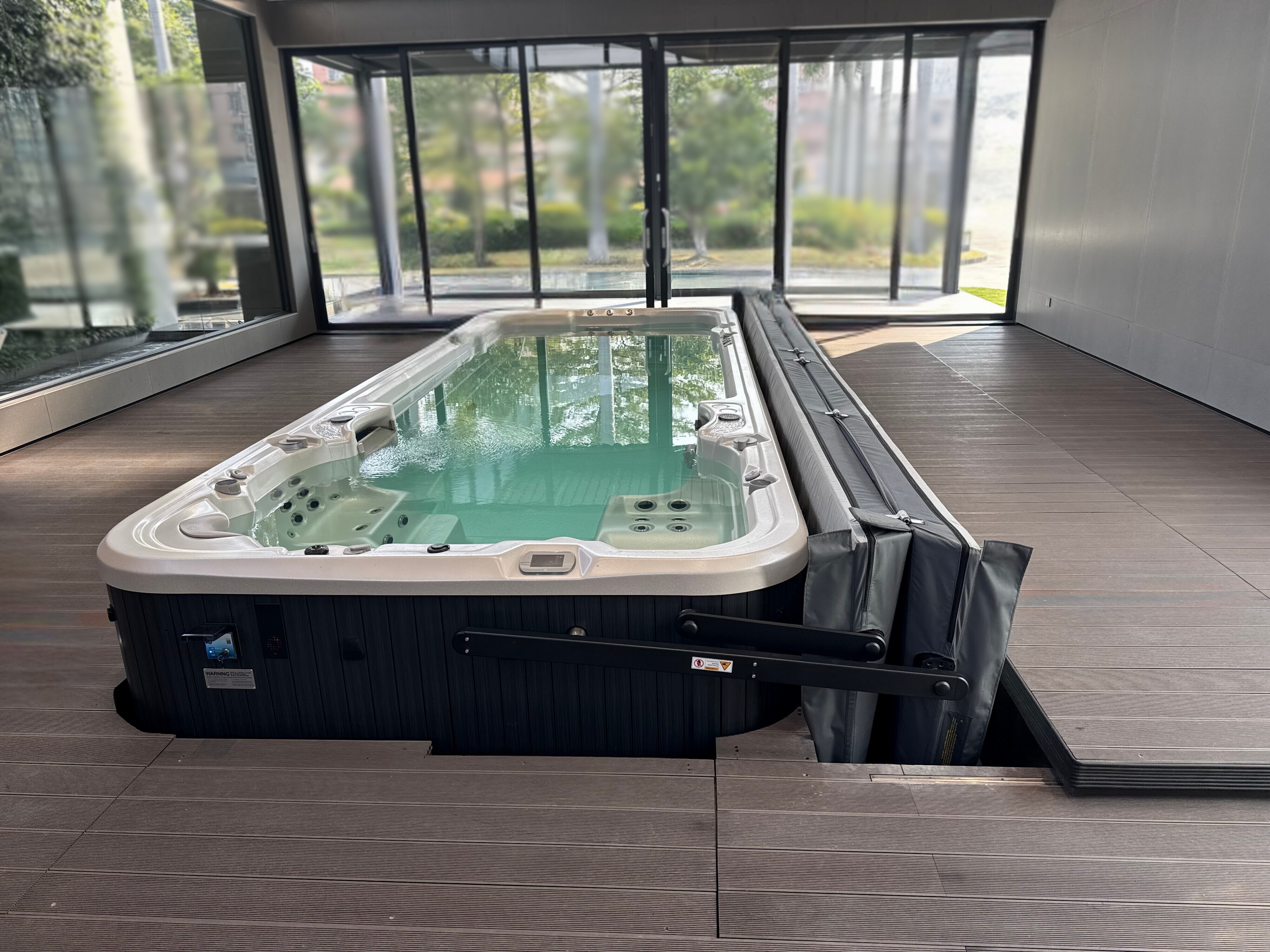 Swim spa on a deck with ClearLift automatic cover