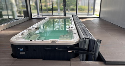 Swim spa on a deck with ClearLift automatic cover