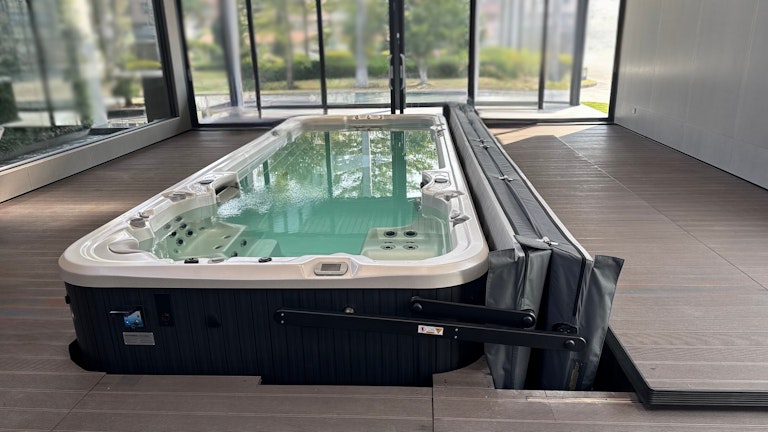 Swim spa on a deck with ClearLift automatic cover