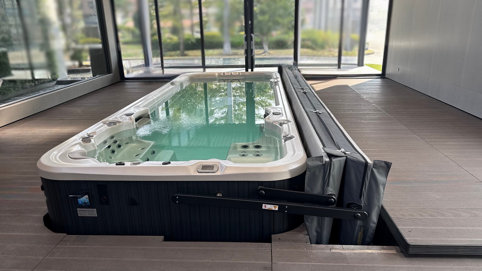Swim spa on a deck with ClearLift automatic cover