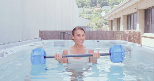 Woman doing upper body workout aqua fitness using Aqua Barbell
