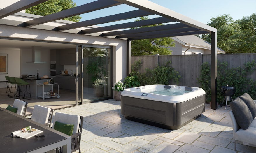 J-325 hot tub in a backyard under a pergola