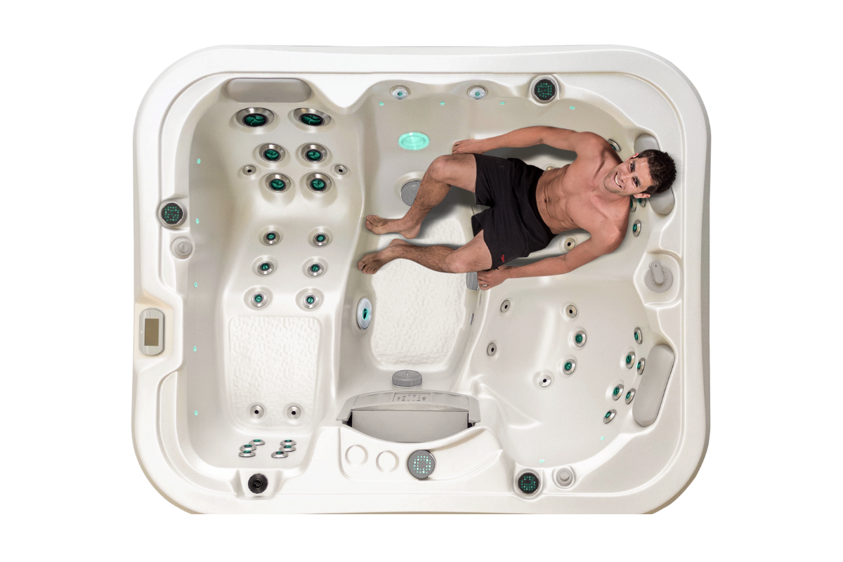 Top down view of the Vortex Neon spa pool with a man on the massage seat