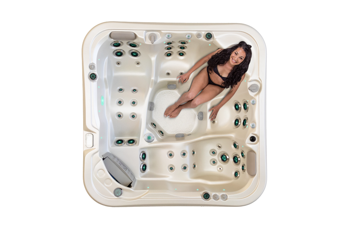 Top down view of the Vortex Cobalt spa pool with a woman on the neck and shoulder therapy seat