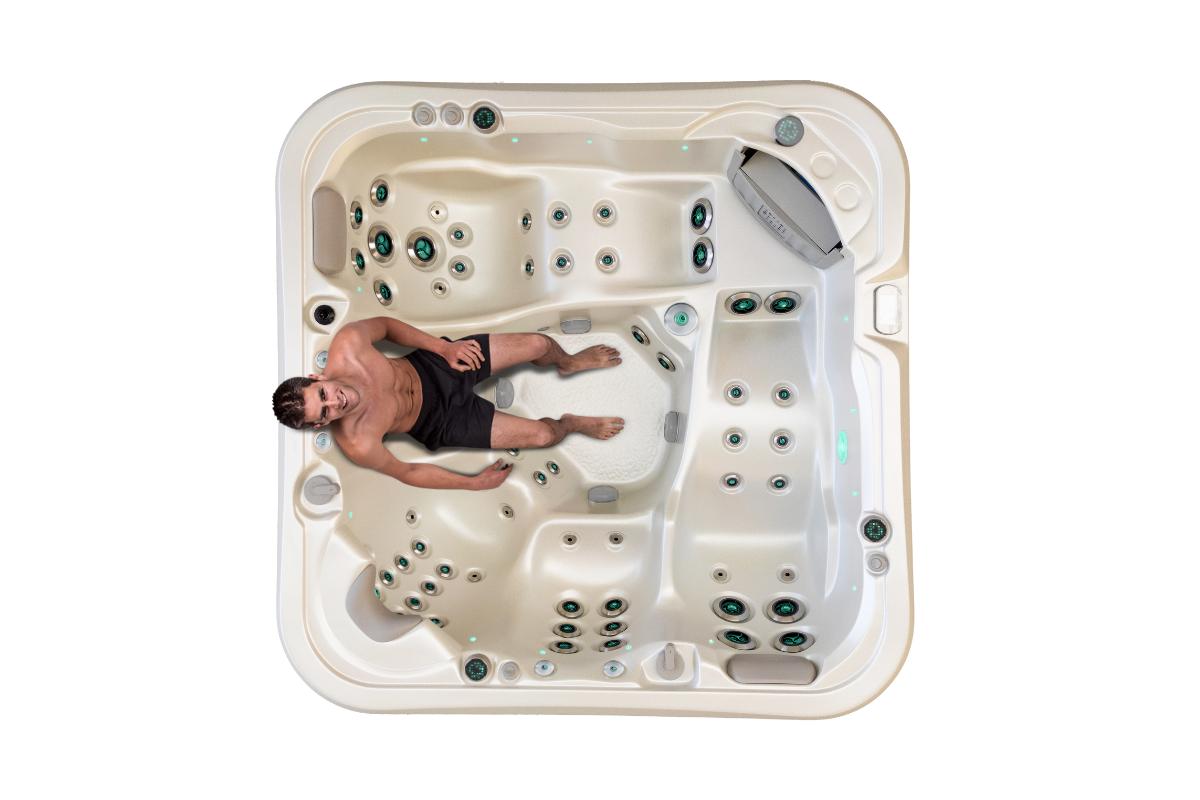 Top down view of the Vortex Cobalt spa pool with a woman on the back massage seat