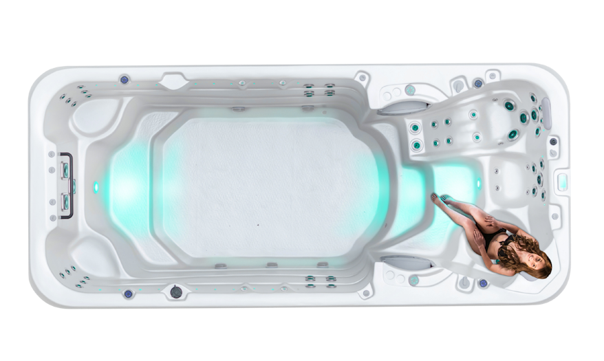 Top down view of a Vortex Aquapace swim spa with a woman on its Neck and Shoulder Therapy Seat