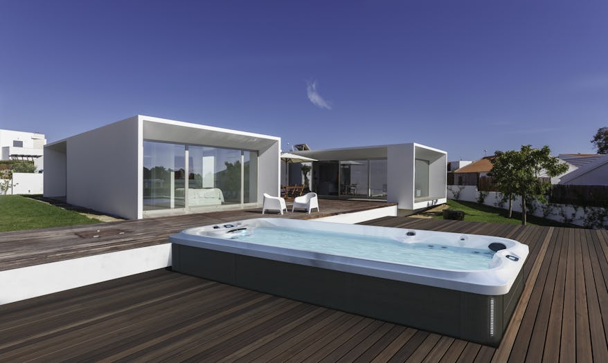 Jacuzzi® 16 PowerPro™ in deck with house in background
