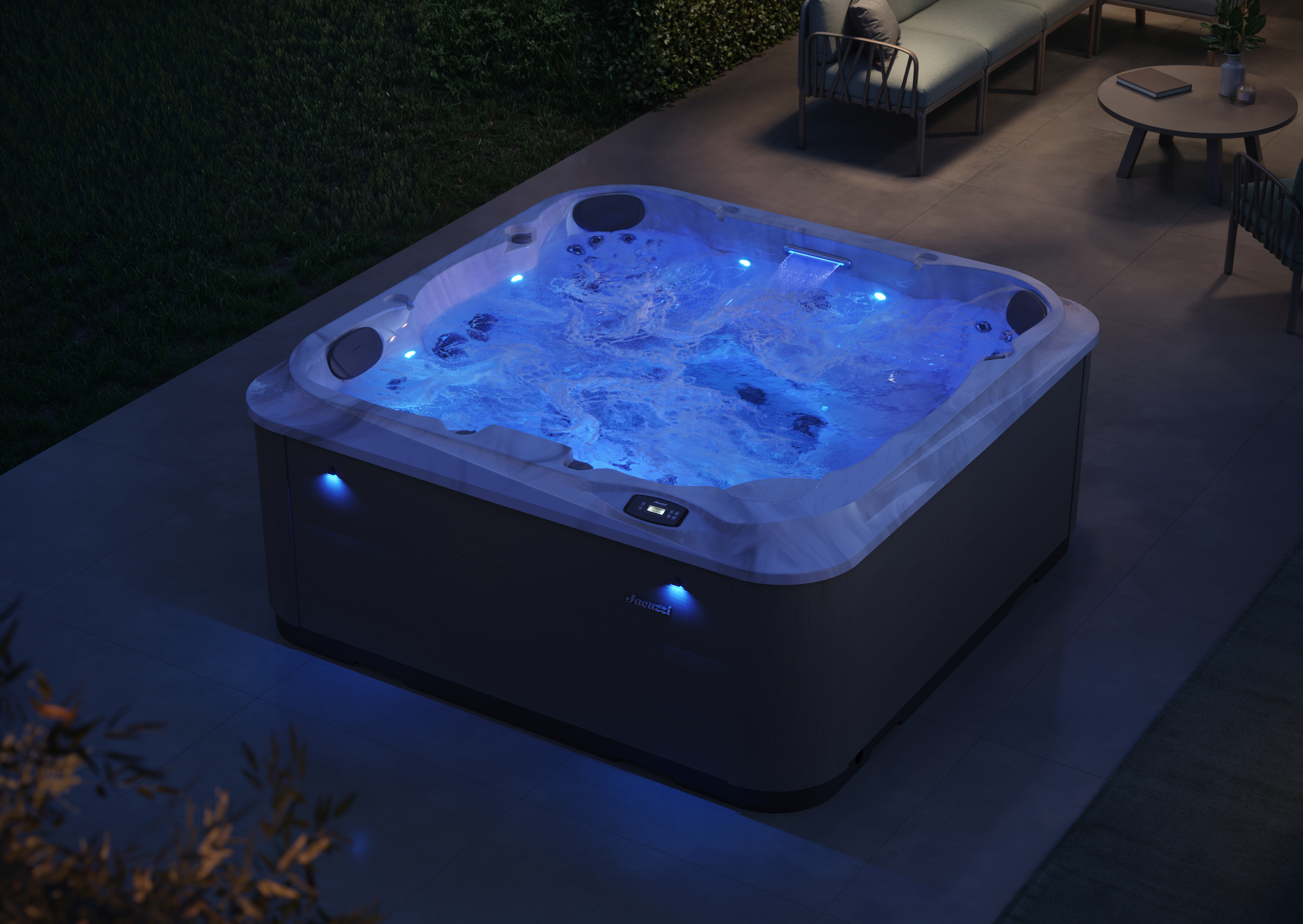 Beautifully-lighted J-201 hot tub at night