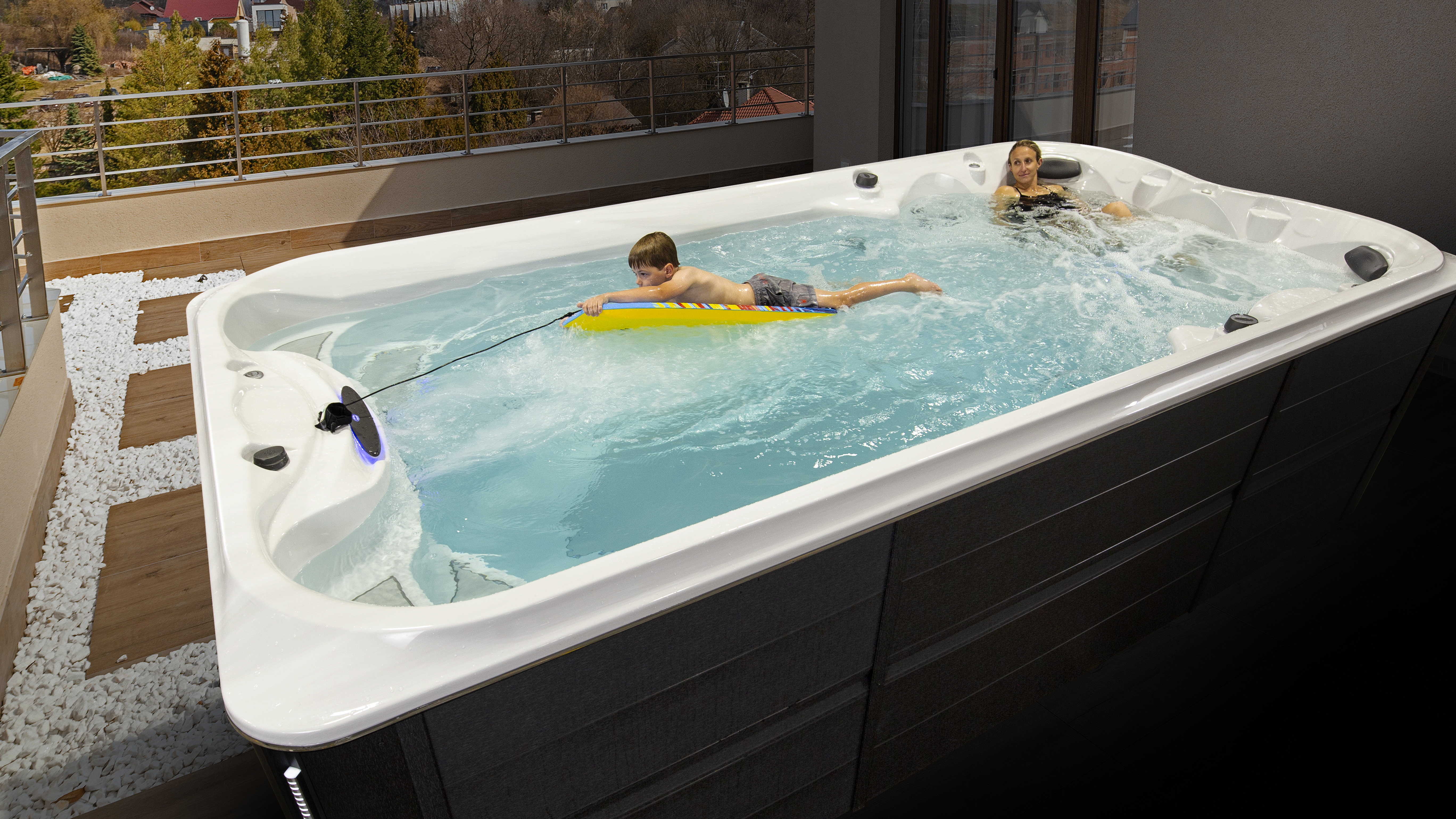 Two kids enjoying the J-16 Power Active swim spa