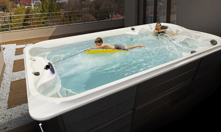 Two kids enjoying the J-16 Power Active swim spa