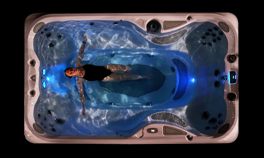 Topdown view of the J-13 PowerPlay with a woman at night with Jacuzzi lights
