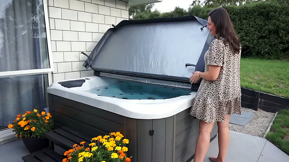 woman lifing a spa cover