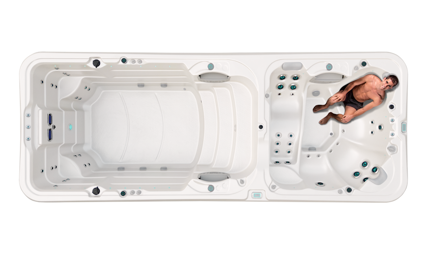 A man sitting on one of the two back massage seats in a Hydrozone Extreme with VCS Jets