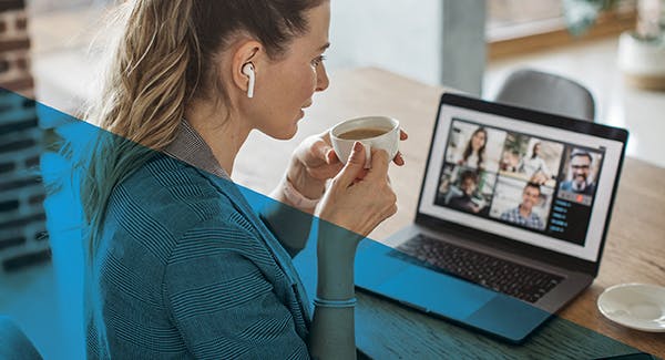 Woman with coffee and laptop