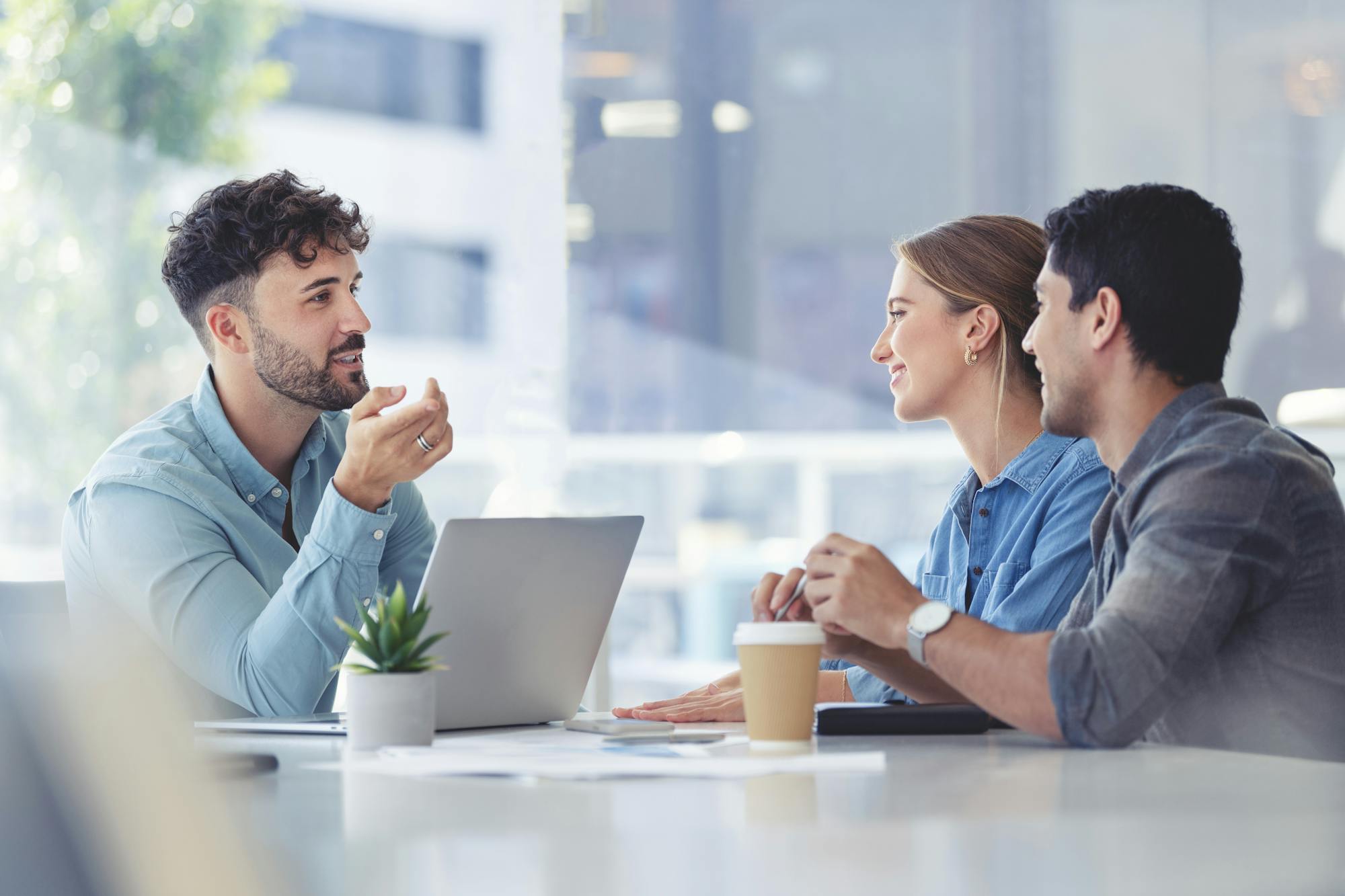 Couple sitting dow at desk refinancing with BankVic