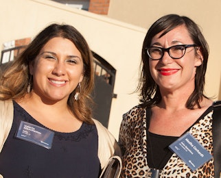 Two employees smiling at Hex 2017.
