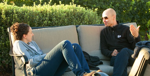 2 HashiCorp employees talking on couch at Hex 2017.