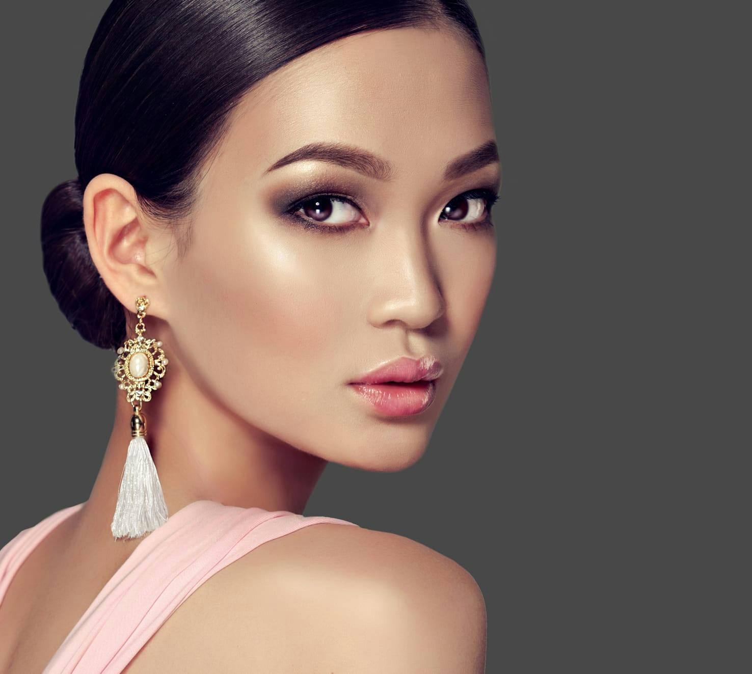 woman with her hair in a low bun