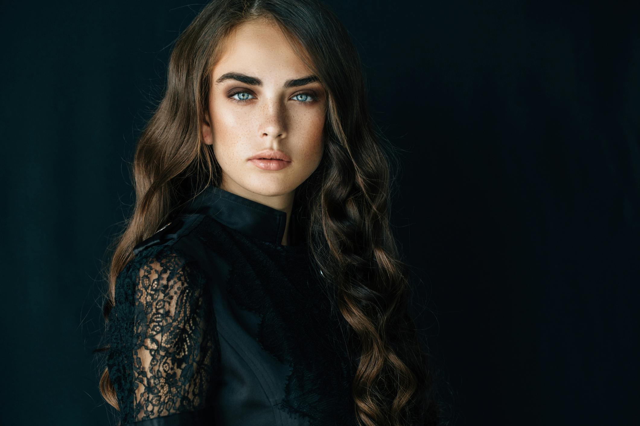woman with long dark curly hair