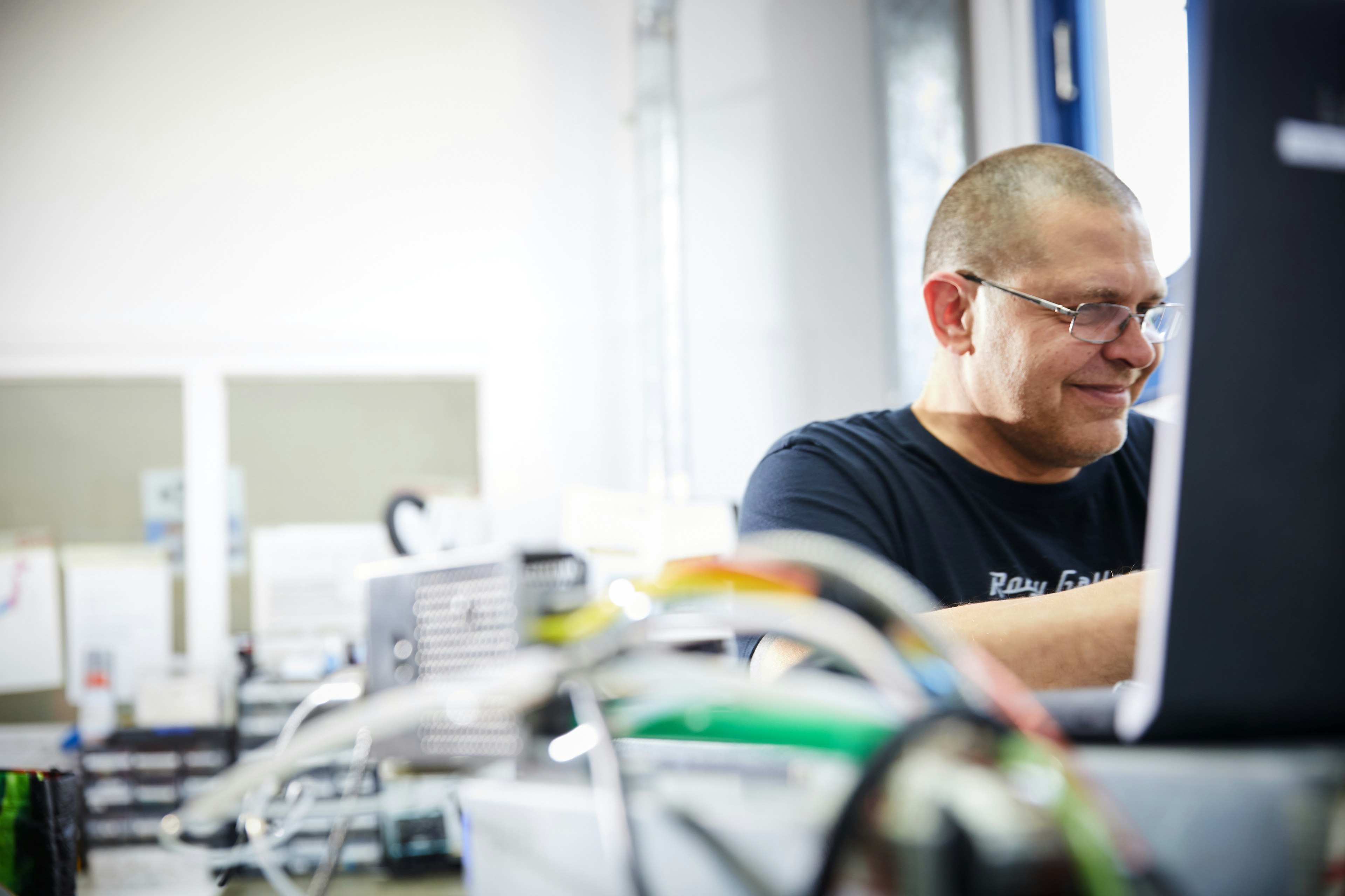 Cambustion test technician working on fast gas analyzers