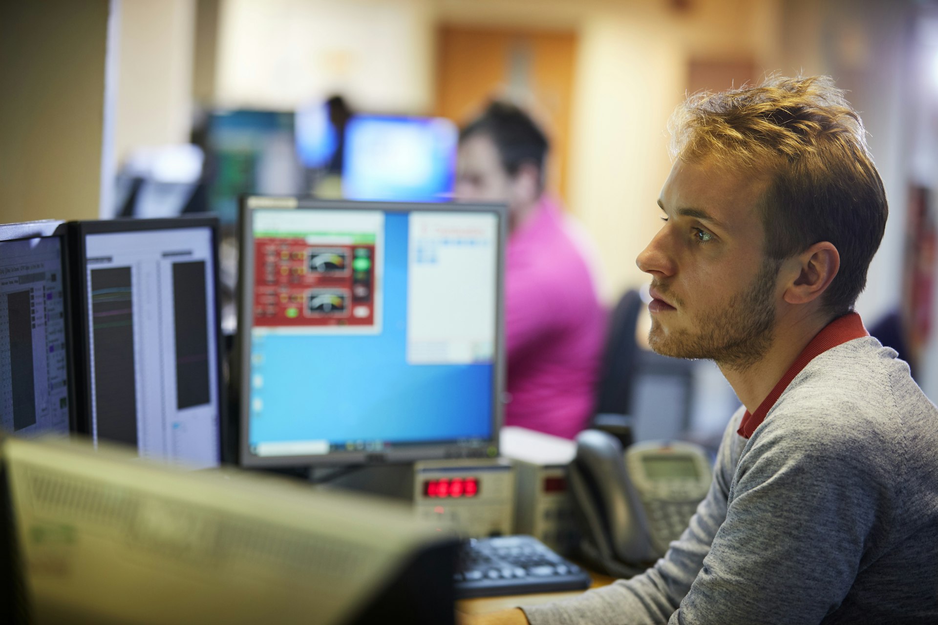 Cambustion engineer looking at screen of test cell data