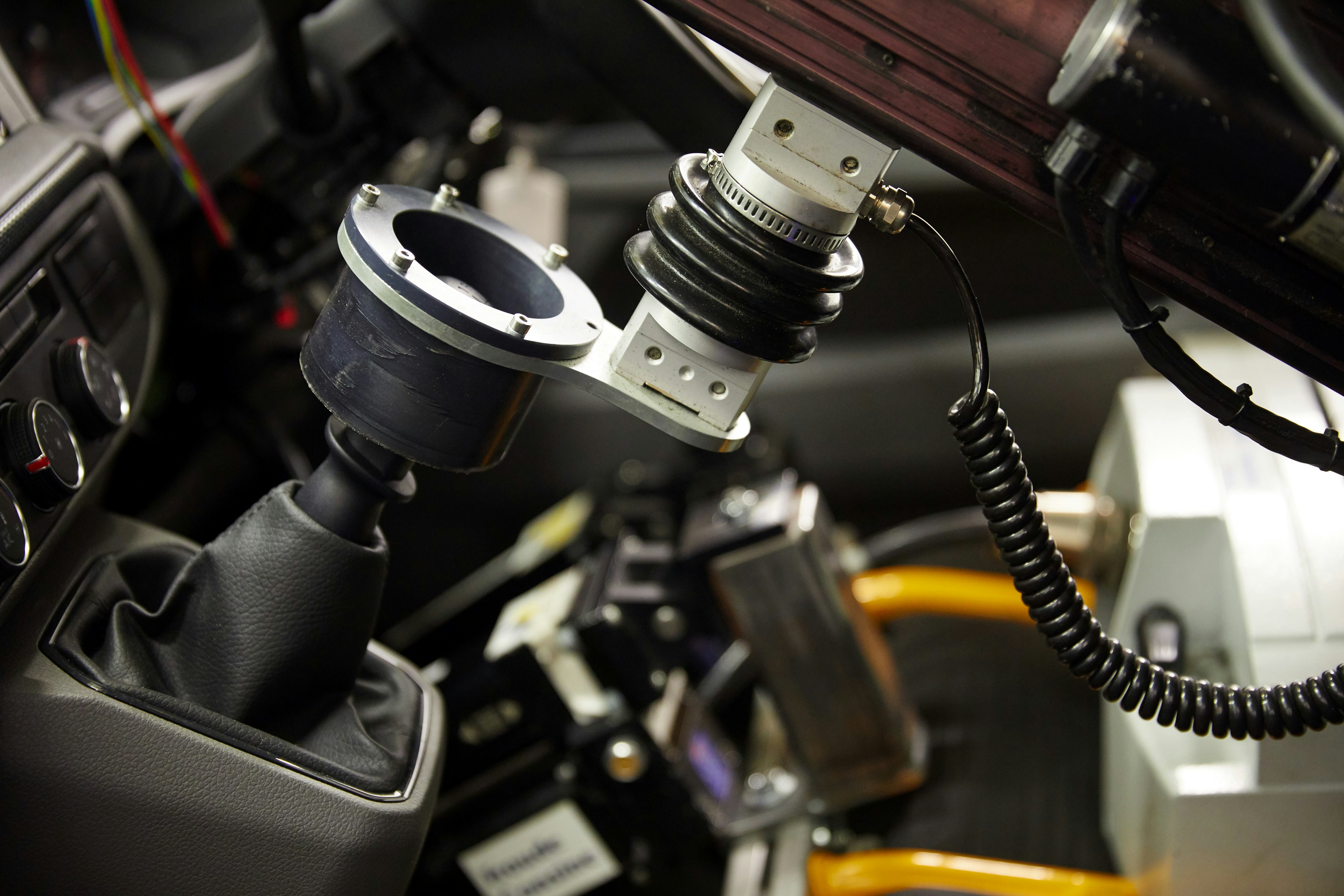 Robot driver attached to vehicle gear stick