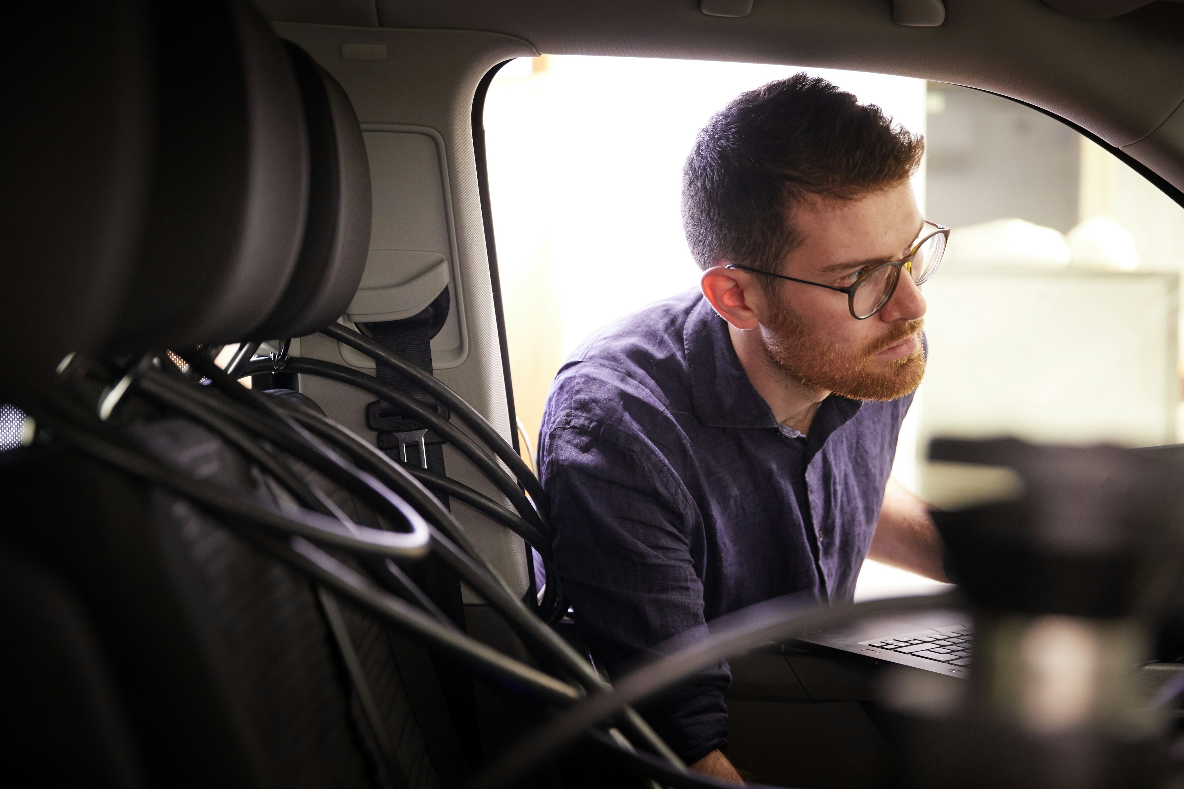 Cambustion engineer working in vehicle