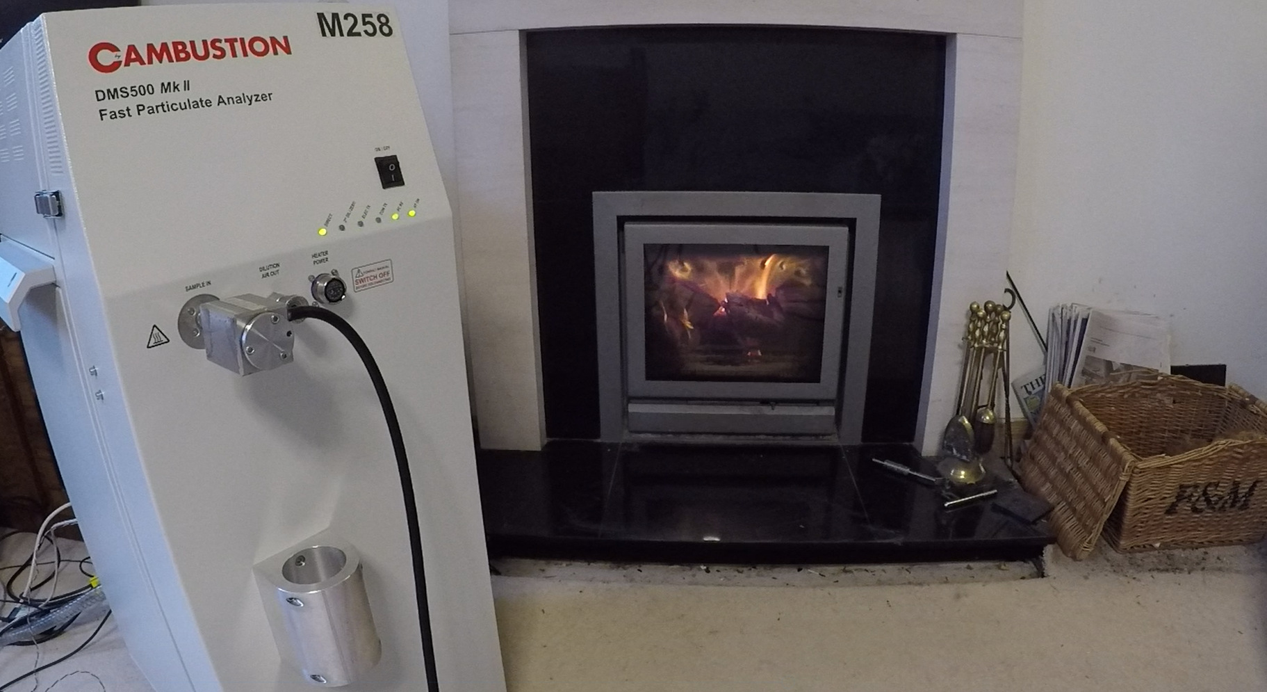 DMS500 monitoring ambient PM in a room with a lit wood stove