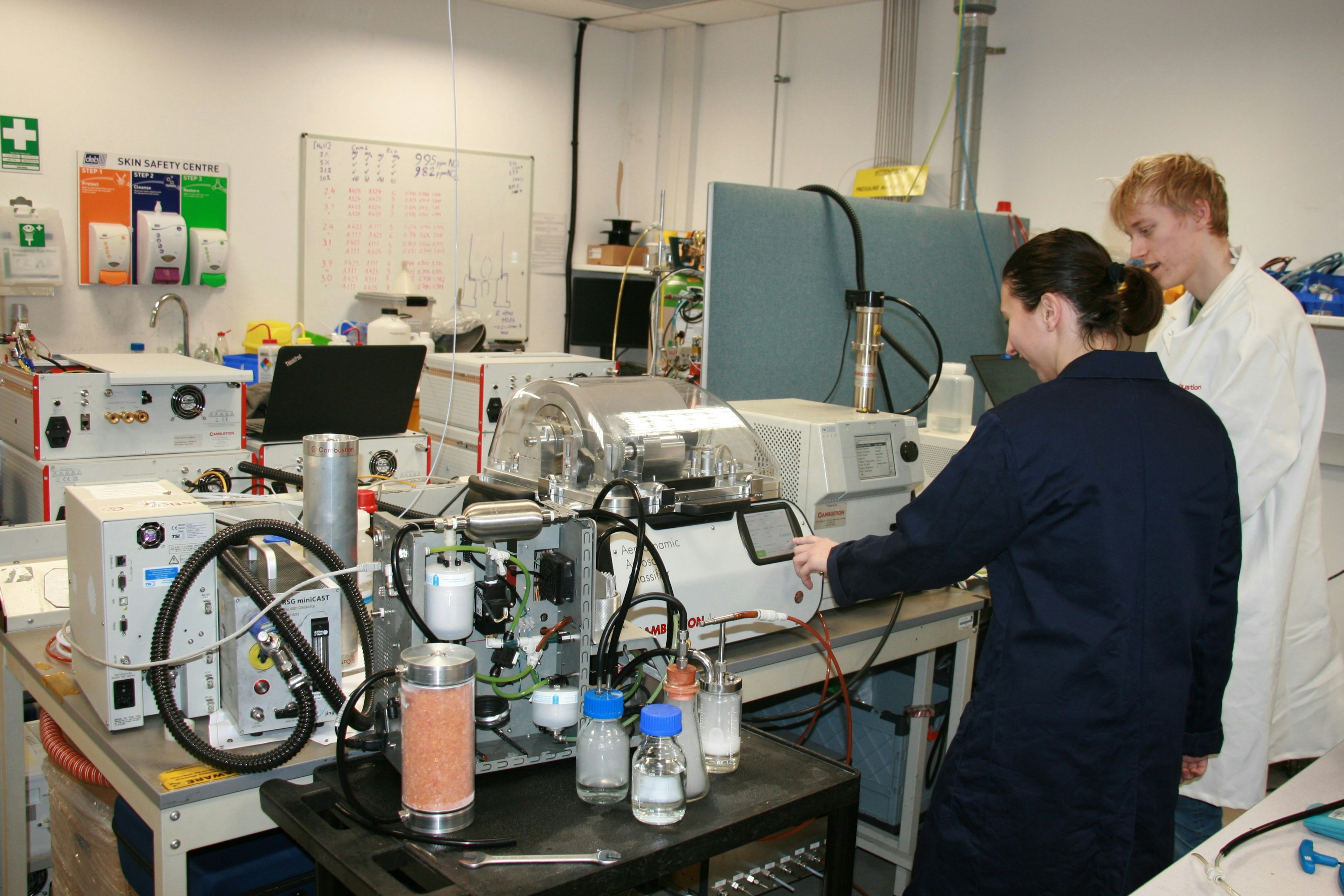 Two scientists in an aerosol science laboratory at Cambustion