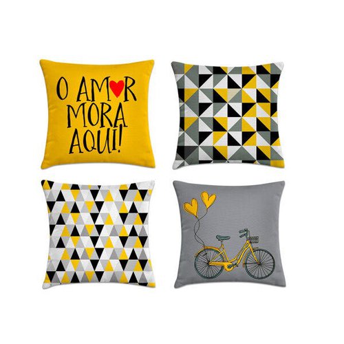 Quatro almofadas, uma cinza com estampa de bicicleta, duas geométricas cinza, preto e amarelo e uma amarela escrita "o amor mora aqui!"