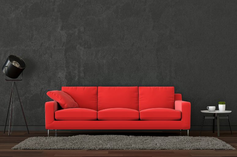 sofá vermelho moderno e parede grafite