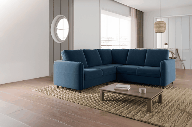 Sofá azul em um sala decorada