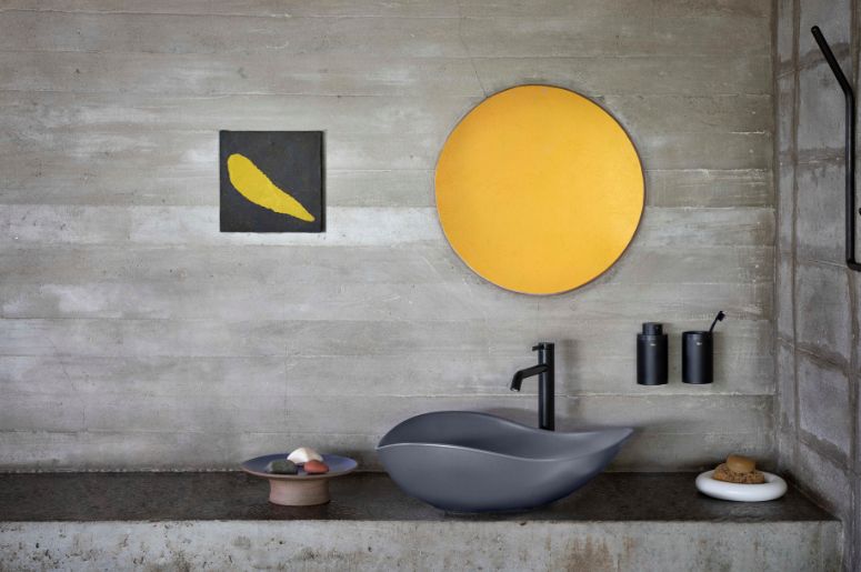 Banheiro com cuba preta e parede cinza