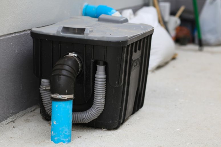 Caixa de gordura com cano azul